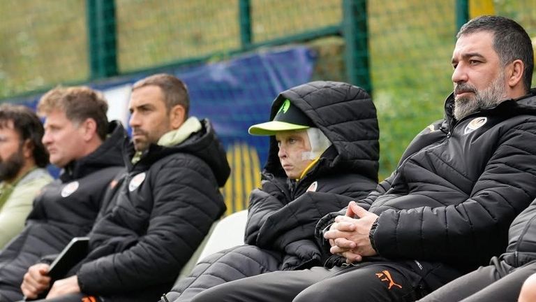 Shakhtar Donetsk coach Arda Turan with young supporter Roman