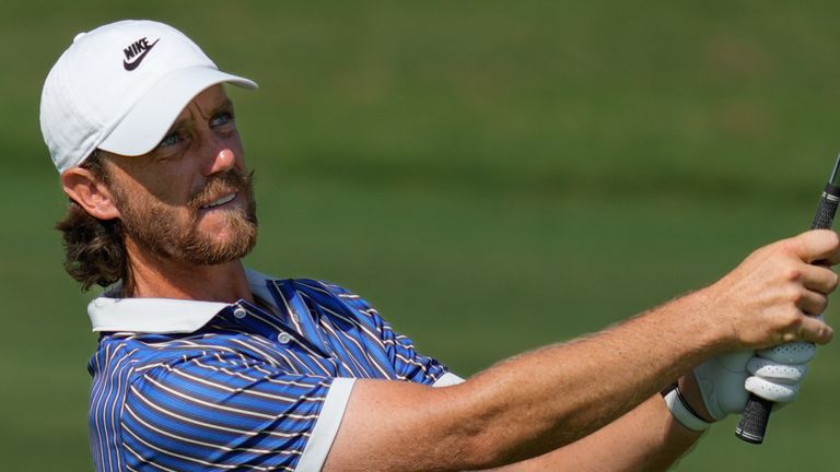 Tommy Fleetwood of England watches his shot from the 5th fairway during the final round of World Tour Golf Champion
