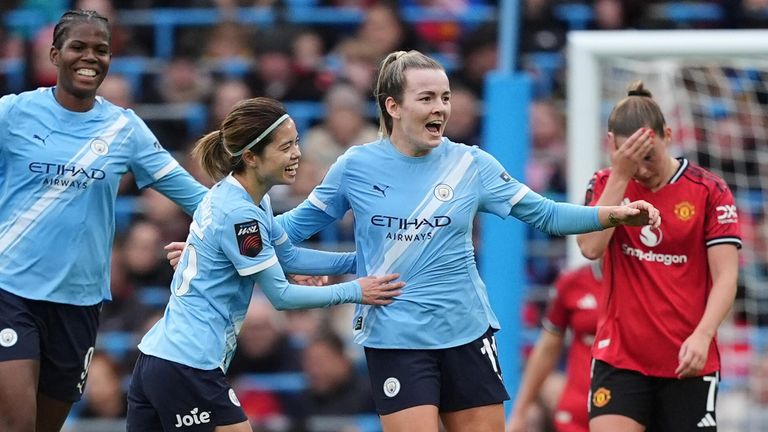 Lauren Hemp celebrates after scoring Manchester City's third goal against Manchester United