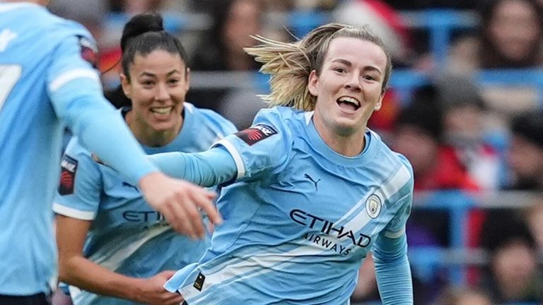 Lauren Hemp celebrates after giving Manchester City a 3-0 lead against Manchester United