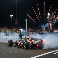 Lando Norris celebrates becoming 2025 F1 world champion at the Abu Dhabi GP