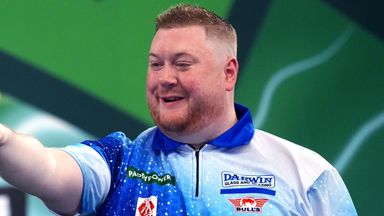 Ricky Evans celebrates victory against Man Lok Leung at the World Darts Championship