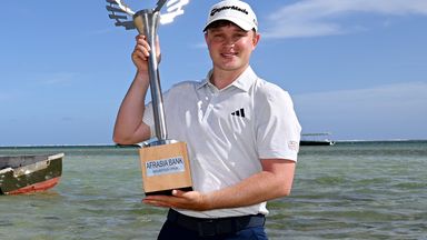 In-form Schaper shows off his trophy on the beach in Mauritius 