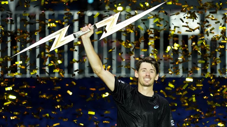 Alex de Minaur celebrates with the trophy during day three of the Victorian Plumbing UTS London Grand Final