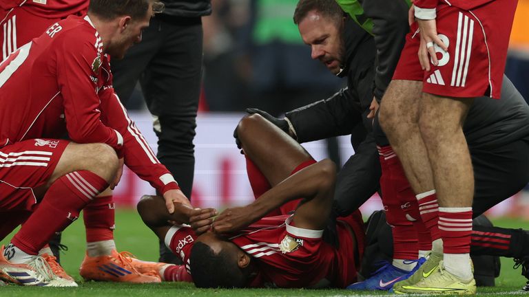 Alexander Isak receives medical assistance  after scoring Liverpool's opener (AP Photo/Ian Walton)