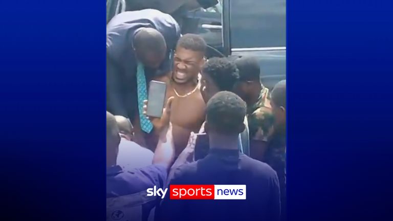 Joshua helped from vehicle after fatal car crash in Nigeria