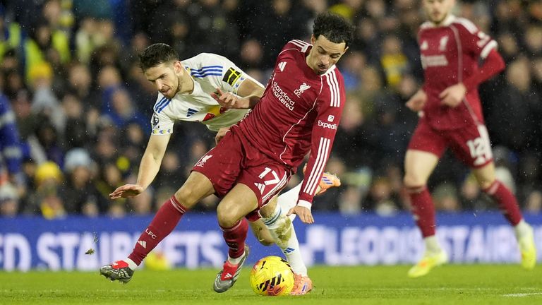 Leeds United's Anton Stach (left) and Liverpool's Curtis Jones battle for the ball 