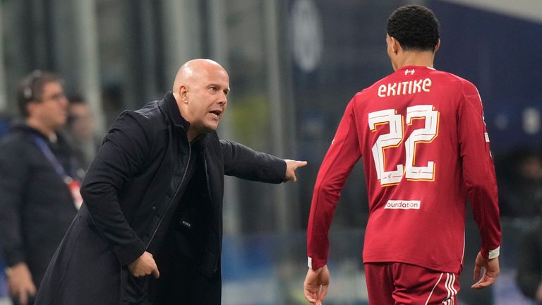 Liverpool's manager Arne Slot speaks to Liverpool's Hugo Ekitike during a Champions League, league phase, soccer match between Inter Milan and Liverpool in Milan, Italy, Tuesday, Dec.9, 2025. (AP Photo/Luca Bruno)