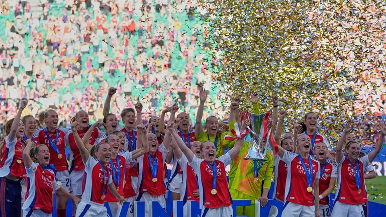 Arsenal players celebrate with their trophy after winning the women's Champions League final 
