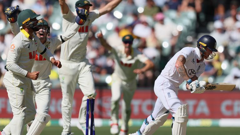 Australian players celebrate after England's Ben Stokes, right, was dismissed during play on day four of the third Ashes cricket test between England and Australia in Adelaide, Australia, Saturday, Dec. 20, 2025. (AP Photo/James Elsby)