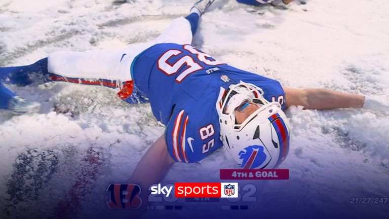 Buffalo Bills players dive into snow angels after touchdown!