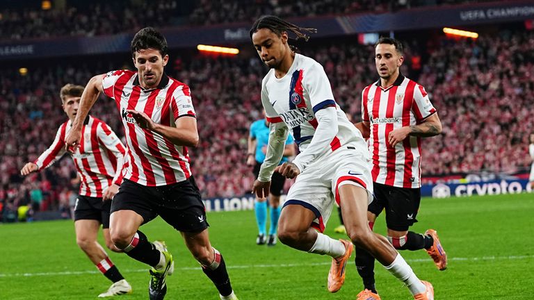 PSG's Bradley Barcola, right, is challenged by Athletic Bilbao's Daniel Vivian during the Champions League opening phase soccer match between Athletic Bilbao and PSG in Bilbao, Spain, Wednesday, Dec.10, 2025. (AP Photo/Miguel Oses)