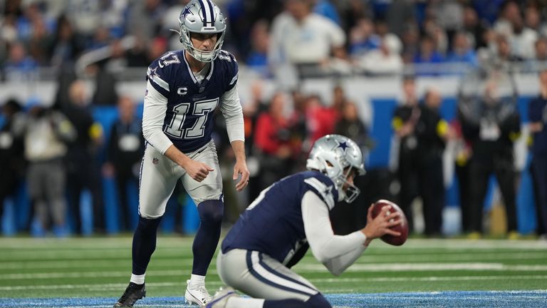 Dallas Cowboys kicker Brandon Aubrey, 17, and Brian Unger attempt a field goal during a holdout against the Detroit Lions during the second half of an NFL football game Thursday, Dec. 4, 2025, in Detroit. (AP Photo/Ryan Sun)