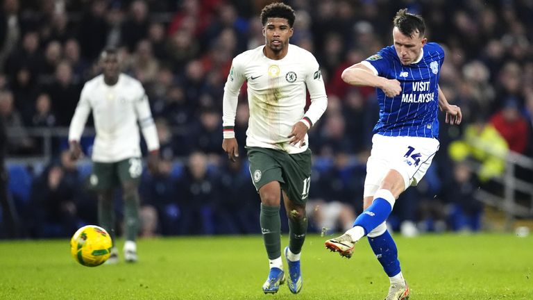 Cardiff City's David Turnbull (right) attempts a shot towards goal