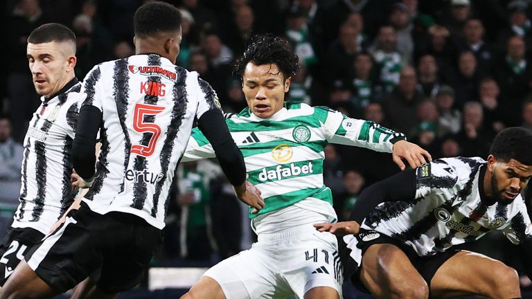 GLASGOW, SCOTLAND - DECEMBER 14: Celtic's Reo Hatate goes close as St Mirren's Shamal George collects during a Premier Sports Cup Final match between St Mirren and Celtic at Barclays Hampden, on December 14, 2025, in Glasgow, Scotland. (Photo by Alan Harvey / SNS Group)