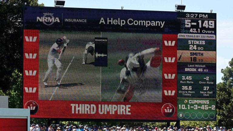 Adelaide Oval's big screen shows replays of Jamie Smith's red card being overturned.