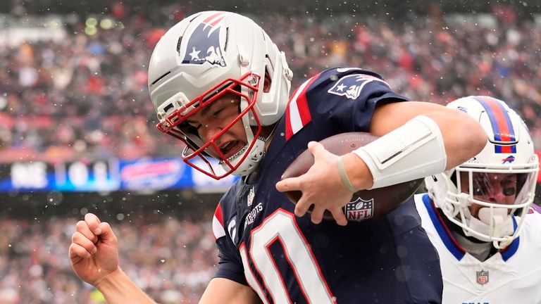 New England Patriots quarterback Drake Maye (10) runs to the end zone to score against the Buffalo Bills during the first half of an NFL football game in Foxborough, Mass., Sunday, Dec. 14, 2025. (AP Photo/Robert F. Bukaty)