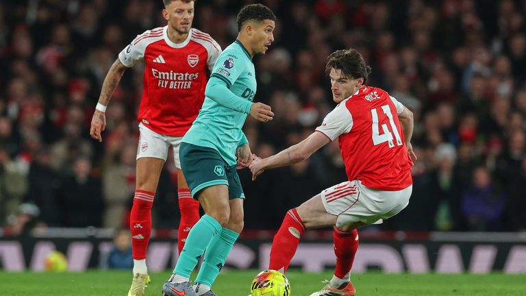 Arsenal's Declan Rice right challenges Wolverhampton Wanderers' Joao Gomes