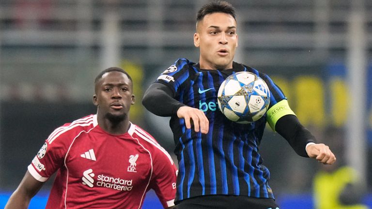 Inter Milan's Lautaro Martinez controls the ball under pressure from Liverpool's Ibrahima Konate