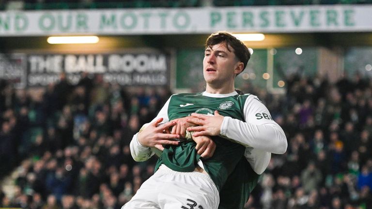 Hibernian's Josh Campbell is hoisted into the air by Kieron Bowie after scoring to make it 3-0