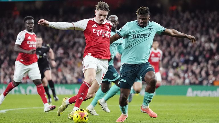 Arsenal's Viktor Gyokeres and Wolverhampton Wanderers' Emmanuel Agbadou battle for the ball