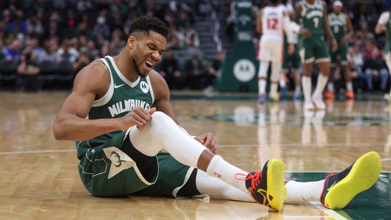 Milwaukee Bucks' Giannis Antetokounmpo reacts after being injured against the Detroit Pistons (AP Photo/Kelly Breedenhagen)