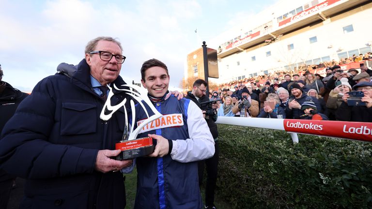Harry Redknapp (left) and jockey Ben Jones with the King George VI Chase trophy after a winning ride by The Jukebox Man