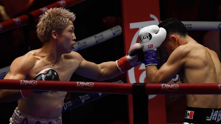 Japan's Naoya Inoue, left, punches Alan Picasso