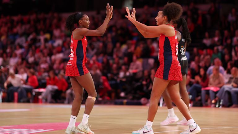 Jaz Brown, during her England debut against New Zealand, high fiving Funmi Fadoju