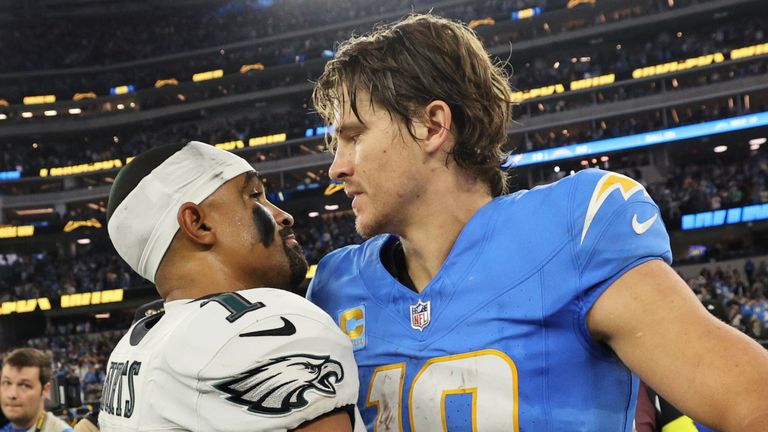Los Angeles Chargers quarterback Justin Herbert (10) hugs Philadelphia Eagles quarterback Jalen Hurts (1) after an NFL football game Monday, Dec. 8, 2025, in Inglewood, Calif. (AP Photo/Kevork Djansezian)