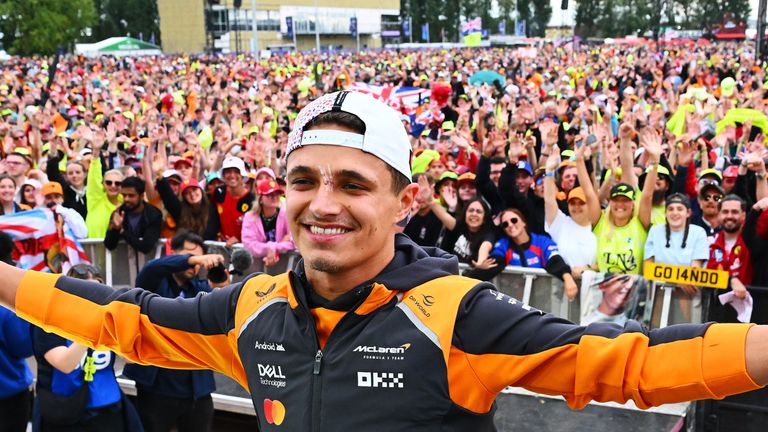 Lando Norris celebrates with fans at Silverstone