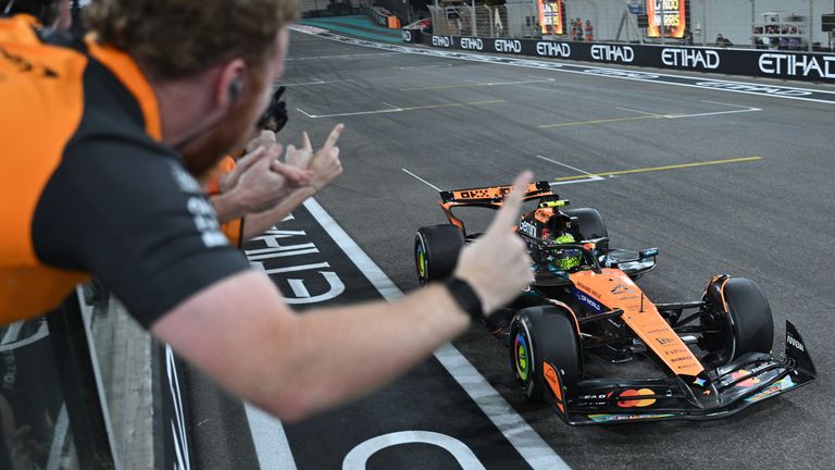 Lando Norris crosses the finish line to become the world champion