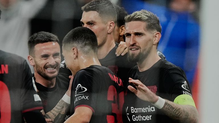 Leverkusen's Robert Andrich,right, celebrates his side's opening goal during the Champions League opening phase soccer match between Bayer Leverkusen and Newcastle United in Leverkusen, Germany, Wednesday, Dec. 10, 2025. (AP Photo/Martin Meissner)