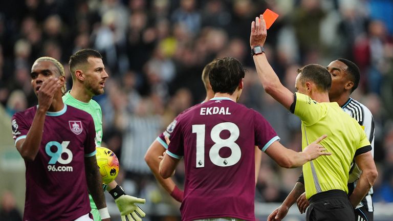 Burnley's Lucas Pires (left) is shown a red card by referee Stuart Attwell 