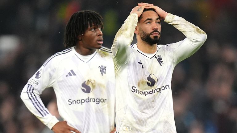 Manchester United's Matheus Cunha (right) and team-mate looks dejected following defeat in the Premier League match