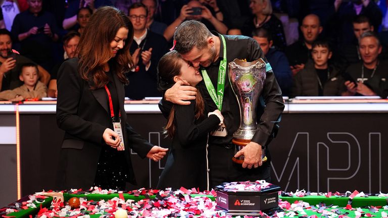 Mark Selby celebrates with his wife Vikki Layton and daughter Sofia after winning the 2025 UK Championship final against Judd Trump