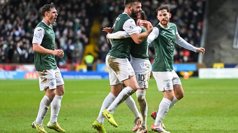 Hibernian's Martin Boyle (C) celebrates with Josh Mulligan, Grant Hanley and Jack Iredale (L-R) after scoring to make it 1-1 