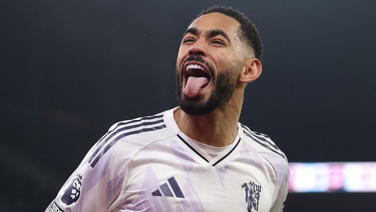 Matheus Cunha celebrates his equaliser in front of the Holte End