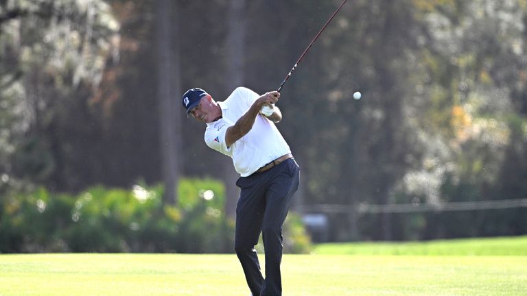 Matt Kuchar hits from the 14th fairway during the PNC Championship golf tournament (AP Photo/Phelan M. Ebenhack)
