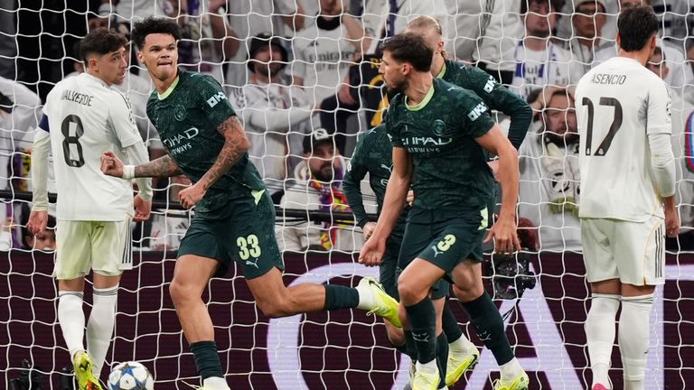 Manchester City's Nico O'Reilly (left) celebrates scoring their side's first goal of the game during the UEFA Champions League match at the 