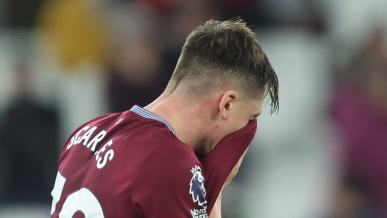 West Ham's Ollie Scarles wipes his face with his shirt following his team's defeat at the Premier League match at the London Stadium.