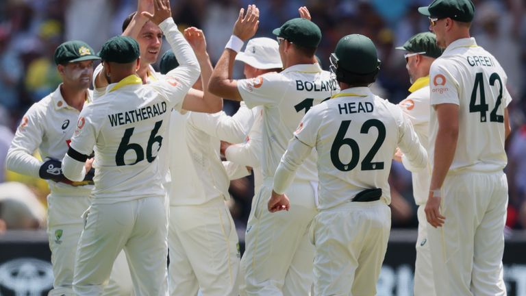 Australia's Pat Cummins is congratulated by teammates after dismissing England's Ben Duckett on day four of the third Ashes Test