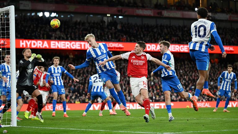 Georginio Rutter glances Declan Rice's corner into his own net to give Arsenal a 2-0 lead against Brighton