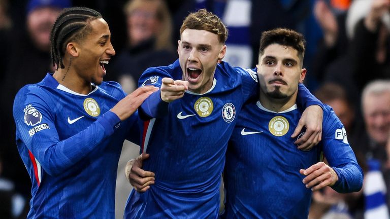 Cole Palmer celebrates with his team-mates after opening the scoring for Chelsea against Everton