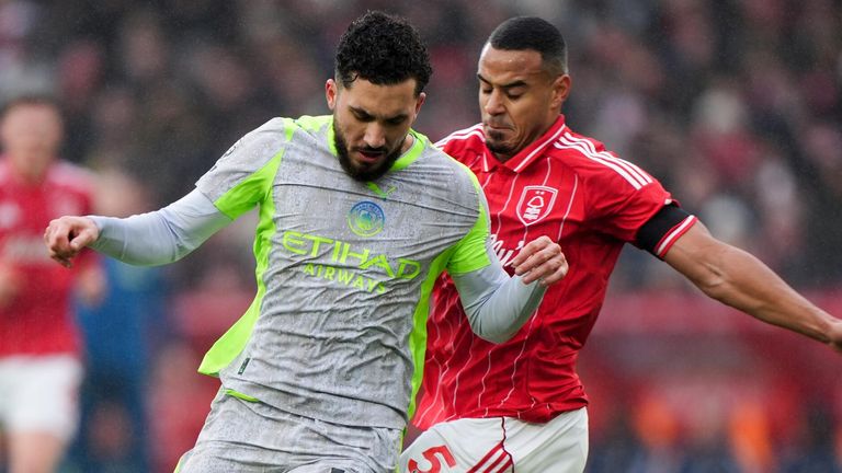 Rayan Cherki and Murillo battle for the ball