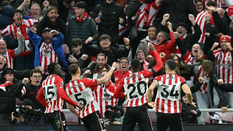 Sunderland players celebrate in front of their fans after taking the lead against Newcastle via a Nick Woltemade own goal