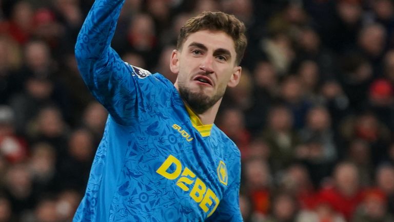 Santiago Bueno celebrates after pulling a goal back for Wolves at Anfield