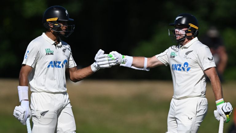 Rachin Ravindra and Tom Latham encourage each other while batting against the West Indies (Andrew Cornaga/Photosport via AP)
