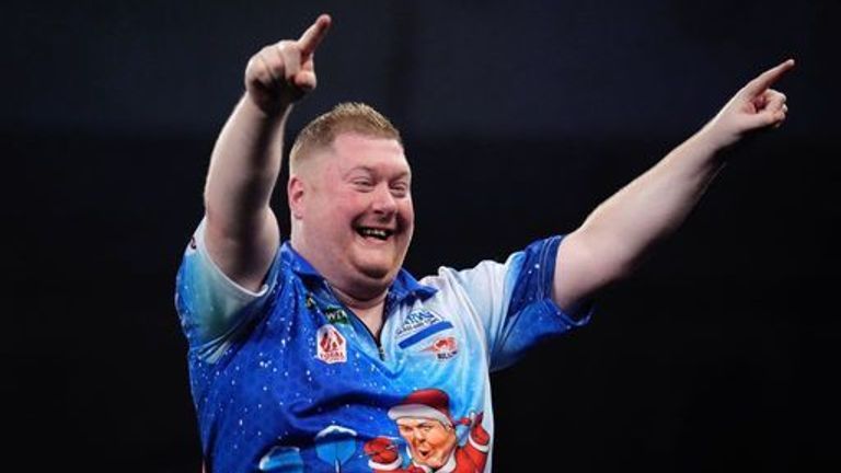 Ricky Evans celebrates defeating England's James Wade on day twelve of the Paddy Power World Darts Championship at the Alexandra Palace, Lon