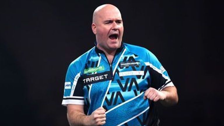 England's Rob Cross reacts during his match against Australia's Damon Heta on day fifteen of the Paddy Power World Darts Championship at the